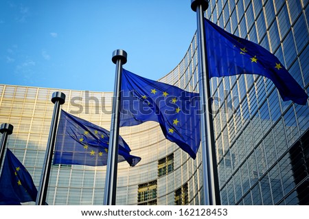 EU flags in front of European Commission in Brussels Royalty-Free Stock Photo #162128453