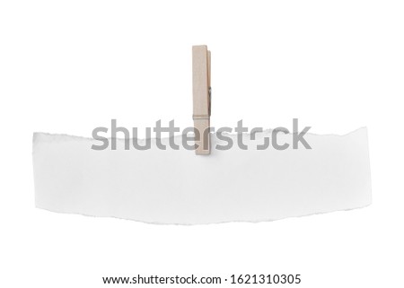 Wooden clip and white paper torn isolated on white background. Object with clipping path