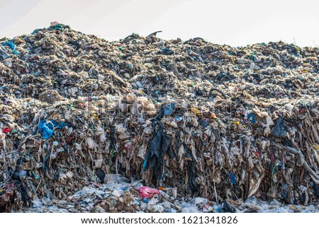 Waste foam, plastics, cloth from households that are hard to degrade and cannot be recycled L Pollution problems of developing countries in Southeast Asia, India, Sri Lanka, Myanmar, Laos, Thailand, V Royalty-Free Stock Photo #1621341826