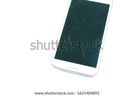 A smartphone with a broken screen on a white background