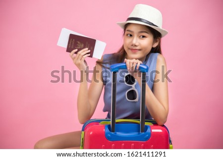 Tourist woman in summer casual clothes.Asian Smiling woman .Passenger traveling abroad to travel on colour background.Asian woman going to summer vacation.Travel trip funny.