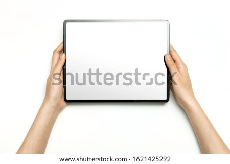 Woman hand hold a tablet isolated on white.