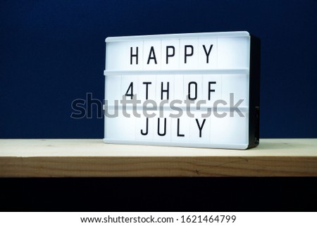 Happy 4th of July lightbox with space copy on blue background