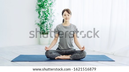 Young asian woman doing yoga.