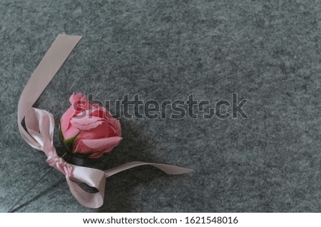 Floral composition with a pink roses and red heart on grey background. Valentine's Day background. Flat lay, top view. Royalty-Free Stock Photo #1621548016
