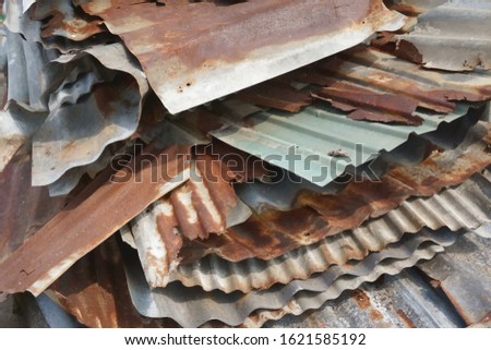 Damaged rusted used galvinized sheets for recycling saving environment and energy , selective focused.