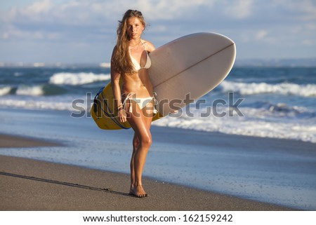 young girl with surfboard 