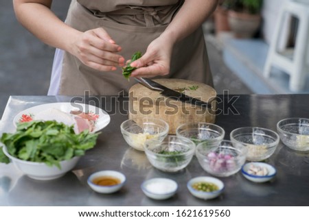 The cook is cooking Kitchen food pictures The image of the hand that is cooking Fresh produce knives And prepare before cooking