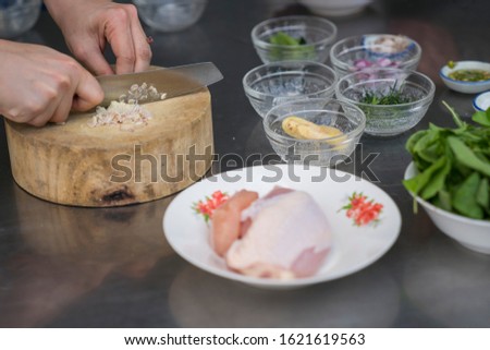 The cook is cooking Kitchen food pictures The image of the hand that is cooking Fresh produce knives And prepare before cooking