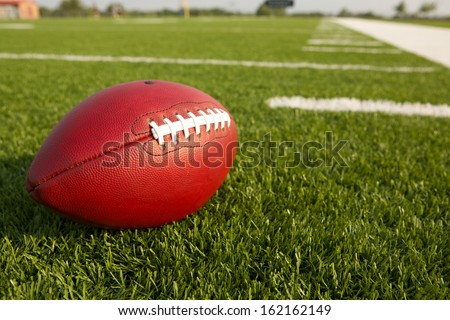 Pro American Football on the Field Close Up with room for copy