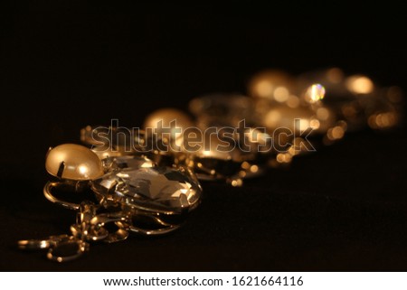 Glittery jewelry reflecting a solitary light