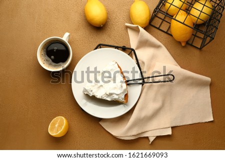 Plate with piece of tasty lemon pie and coffee on table