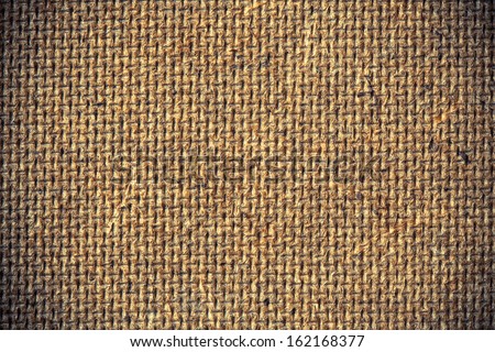Fiberboard texture pattern, brown abstract background. Rough side of a piece of hardboard with vignette