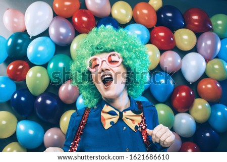Portrait of beautiful party woman in wig and glasses (Carneval)