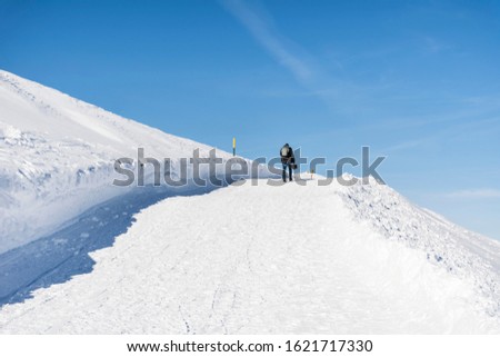 Man in the High Snowy Mountain .Winter Vacation Concept 
