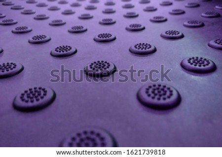 A dimpled background with raised round dots purple Royalty-Free Stock Photo #1621739818