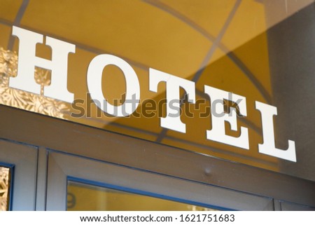Hotel logo text Sign on Building windows