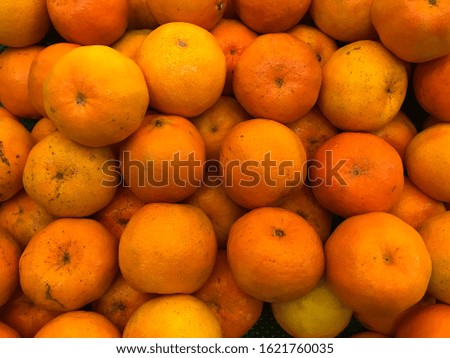 Many orange fruit picture. Background and texture.