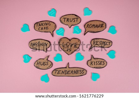 Love components, messages written on the cartoon bubbles on the pink background. St. Valentine's day concept. Tenderness, hugs, passion, taking care, trust, romance, respect, kisses. 