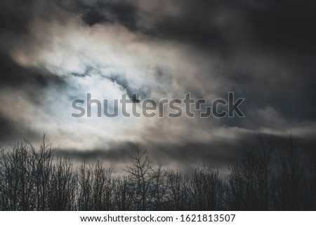 Dramatic sunset with dark clouds