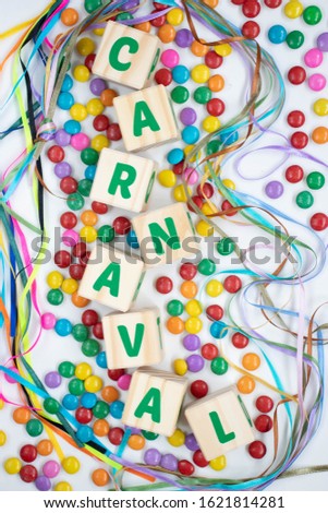 The word carnival written in portuguese with letter blocks on a white background