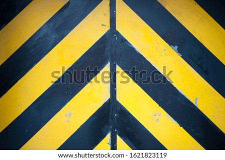 Black and yellow stripes in an eye-catching full frame hazard background