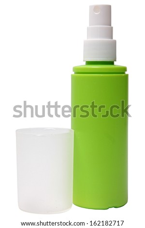 Green plastic bottle of spray isolated on a white background.