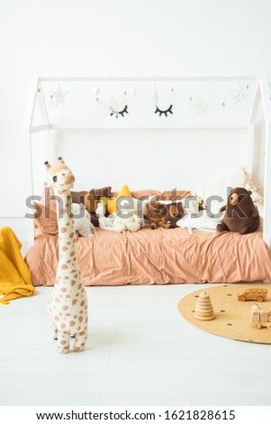 Interior of the children's room. Soft bed and lots of toys