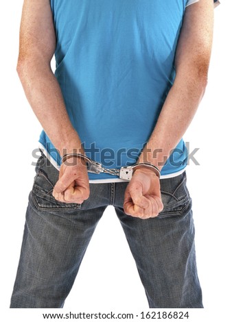 man with handcuffs on his back Royalty-Free Stock Photo #162186824