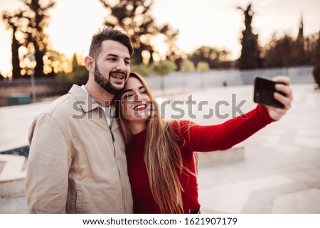 boy and girl making a selfie at sunset, lifestyle concept