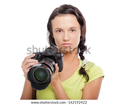 Beautiful young woman with camera.Isolated on white background