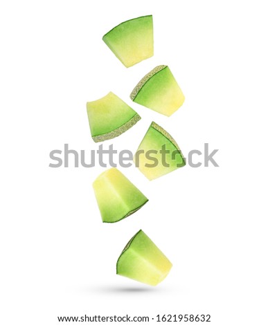 Falling slices of Cantaloupe melon isolated on white background. Royalty-Free Stock Photo #1621958632
