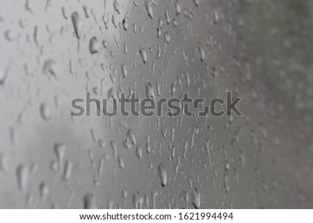rain drops on the grey car paint