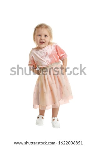 Cute little girl posing on white background