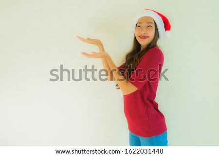 Portrait beautiful young asian women wearing santa hat for celebration in christmas anniversary day