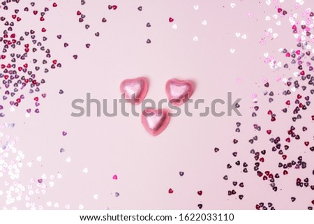 Conffeti hearts on a pink pastel trendy background Valentine's day