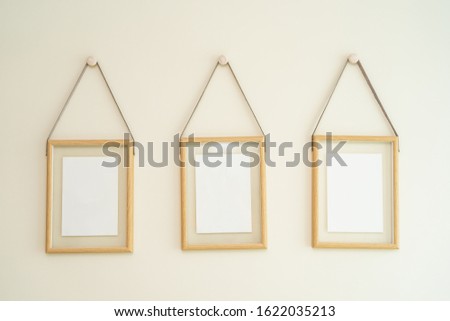 Empty photo frame on wall decoration interior of room