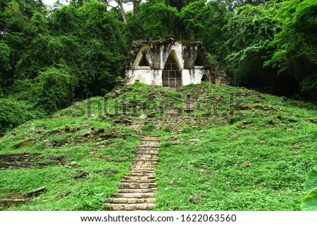 A view of the Temple of the Foliated Cross in Palenque ancient Mayan ruins in Chiapas, Mexico.  Royalty-Free Stock Photo #1622063560
