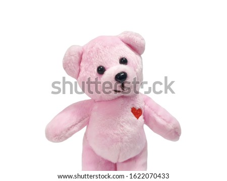 Cute teddy bear  isolated on white background with copy space.Smile of friendship.Pink teddy bear with heart shaped embroidery. gift for valentine day.