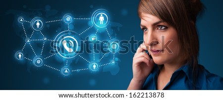 Pretty young girl making phone call with social network icons