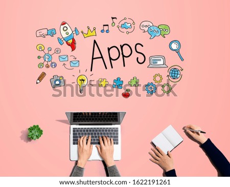 Apps with people working together with laptop and notebook