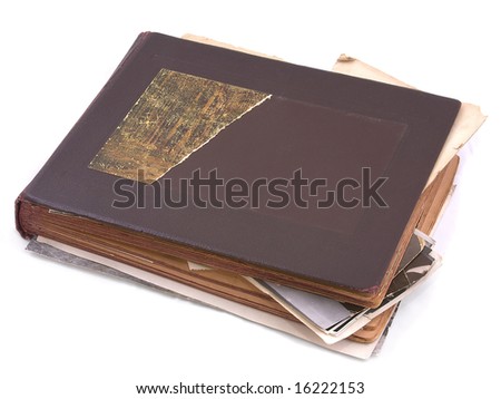 Old photo album with photos isolated on white.