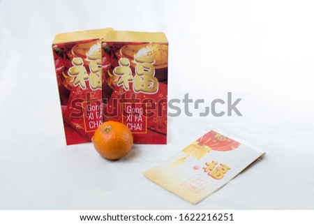 Ang Pow  or red envelope filled with Money Special Gift When Chinese new year or Lunar New Year (Text on Envelope means Happy new year and Happiness)  
