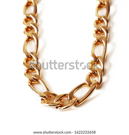 golden chain necklace or bracelet on white background