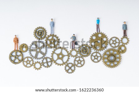 People stand on gears. Businessmen concept business idea, teamwork, innovation, cooperation, partnership