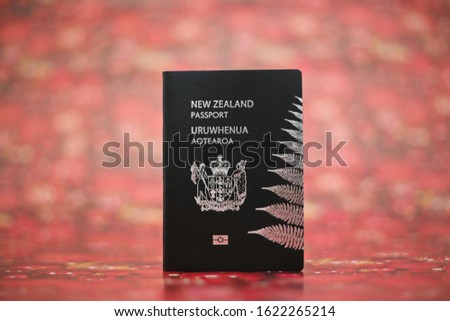 New Zealand passport on red background