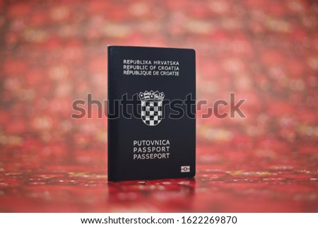 Croatian passport on red background