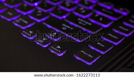 A computer keyboard is a typewriter-style device which uses an arrangement of buttons or keys to act as mechanical levers or electronic switches. Royalty-Free Stock Photo #1622273113