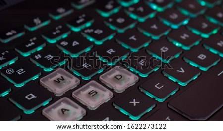 A computer keyboard is a typewriter-style device which uses an arrangement of buttons or keys to act as mechanical levers or electronic switches. Royalty-Free Stock Photo #1622273122