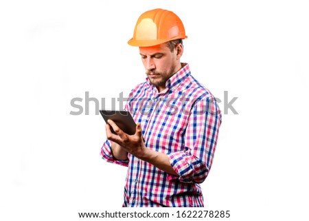 A builder in the helmet on a white background. Director